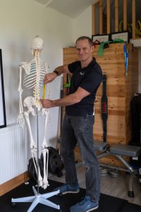 Paul Collins of Paul Collins Fitness using his skeleton to demonstrate Intrinsic Biomechanics